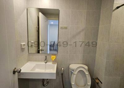 Compact Bathroom with Toilet and Sink