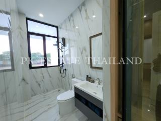 Modern bathroom with marble tiles and natural light