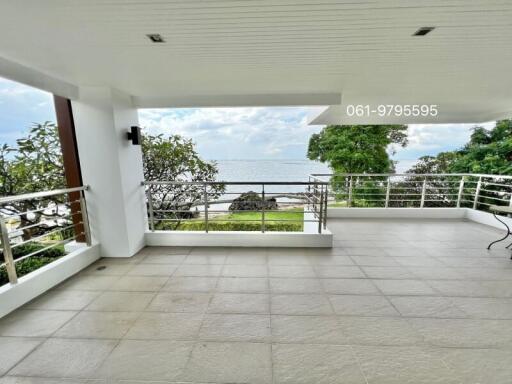 Spacious balcony with ocean view and tile flooring