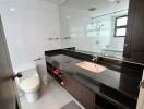 Modern bathroom with spacious vanity and glass shower
