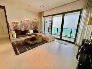 Spacious living room with a sea view and modern furnishings