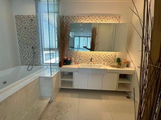 Modern bathroom interior with bathtub and vanity