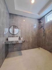 Modern bathroom interior with large tiled shower space