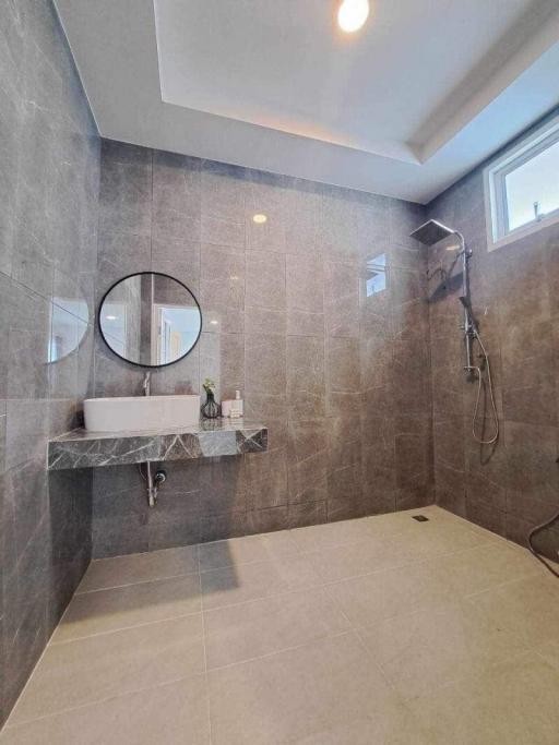 Modern bathroom interior with large tiled shower space