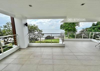Spacious balcony with ocean view and ceramic tiled flooring
