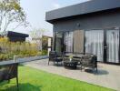 Modern outdoor patio with furniture and artificial grass