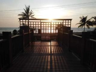 Seaside balcony at sunset with a view of the ocean