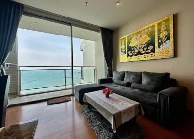 Cozy living room with ocean view, modern sofa and art decor