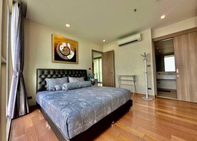 Elegant bedroom with wooden flooring and modern decor
