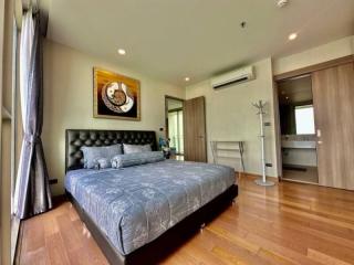 Elegant bedroom with wooden flooring and modern decor