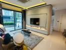 Modern and brightly lit living room with ample seating and entertainment area