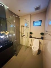 Modern bathroom interior with glass shower and elegant fixtures