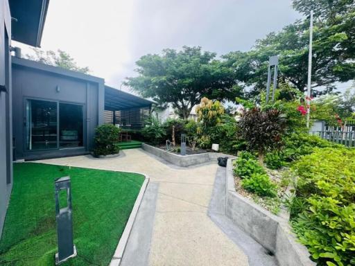 Modern house exterior with landscaped garden and pathway