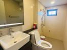 Modern bathroom interior with sink, toilet, and shower