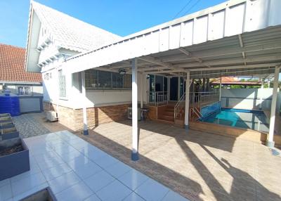 Spacious outdoor area with pool and patio