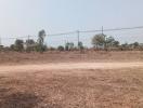 Open land with clear skies and dry vegetation