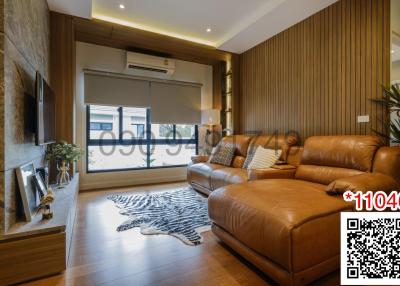Elegant living room interior with large comfortable leather sofa