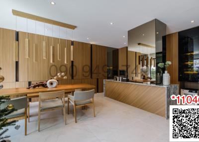 Modern kitchen with wooden cupboards and an adjoining dining area