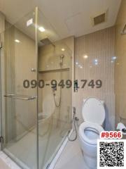 Modern bathroom interior with glass shower division and toilet