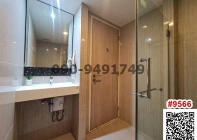 Modern bathroom with shower and wooden cabinet