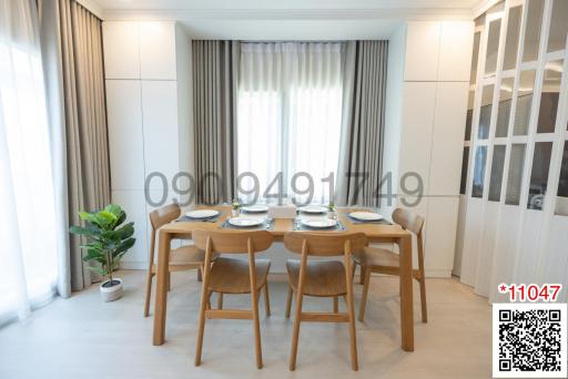 Modern dining room with table set for four and natural light