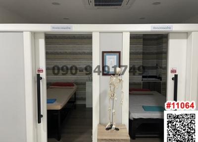 Bedroom with sliding doors and a medical skeleton model