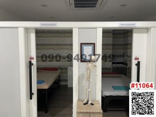 Bedroom with sliding doors and a medical skeleton model