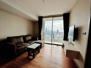 Modern living room with cityscape view through large windows