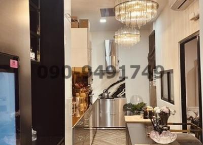 Modern kitchen interior with elegant chandelier and sleek design