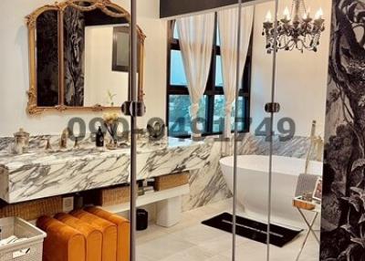 Luxurious bathroom with marble countertops and modern decor