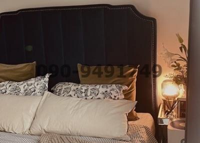 Cozy bedroom with luxurious bedding and ambient lighting