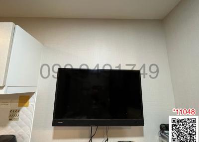 Wall-mounted flat screen TV in a modern living room