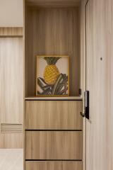 Modern hallway with wooden finish and pineapple artwork