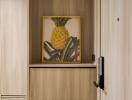 Modern hallway with wooden finish and pineapple artwork