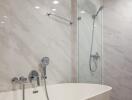 Modern bathroom interior with freestanding tub and glass shower enclosure