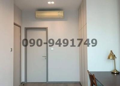 Spacious unfurnished room with air conditioning unit and wooden floors