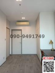 Spacious unfurnished room with air conditioning unit and wooden floors