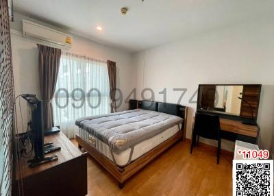 Spacious bedroom with large bed and ample natural light