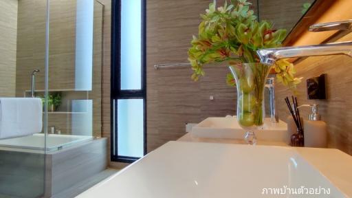 Modern bathroom interior with dual sinks and glass shower