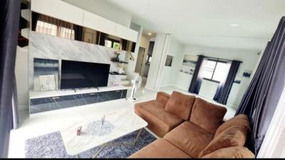 Modern living room interior with comfortable sofa and entertainment wall unit