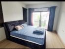 Modern bedroom with double bed and large window