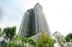 Modern high-rise residential building against a clear sky