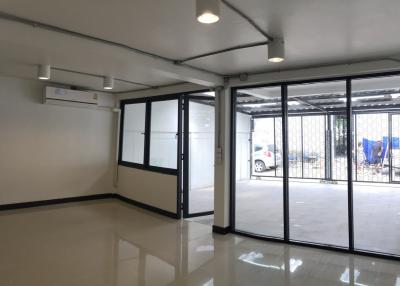 Bright and open commercial space with large glass windows and tiled flooring