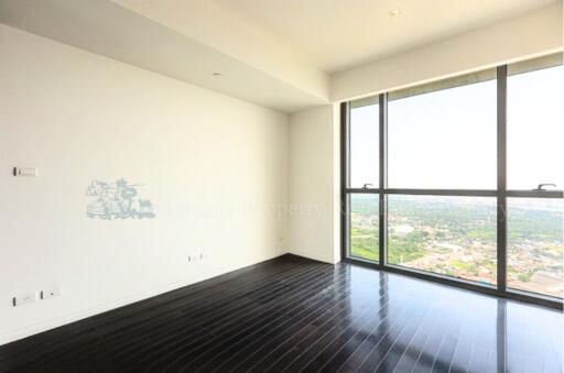 Spacious Bedroom with Large Windows and a View