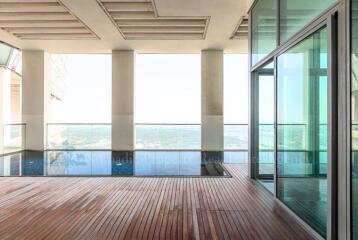 Spacious balcony with wooden decking and panoramic view