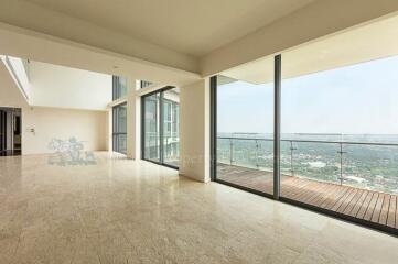 Spacious modern living room with large windows and city view