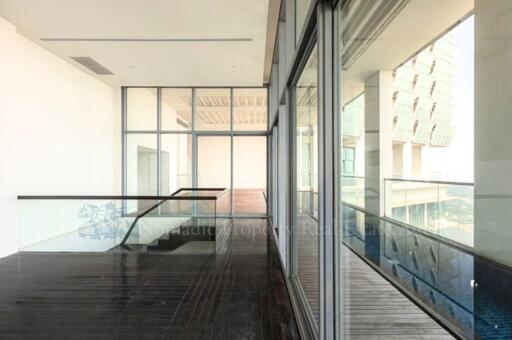 Spacious and modern indoor balcony with large glass windows
