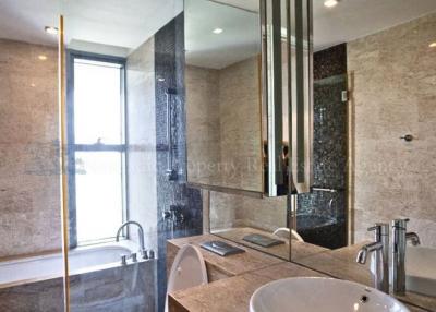 Modern bathroom with a glass-enclosed shower and bathtub