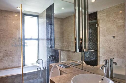 Modern bathroom with a glass-enclosed shower and bathtub