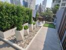 Modern balcony with greenery and city view